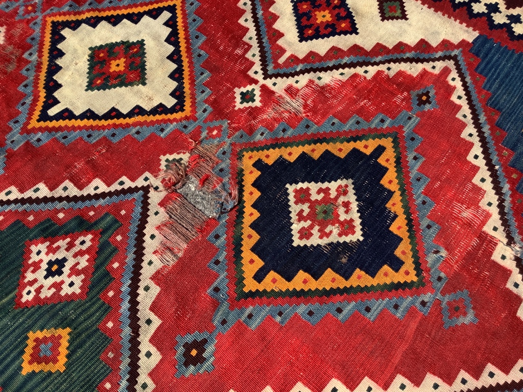 A Kelim polychrome flatweave carpet (worn), approx. 150 x 300cm